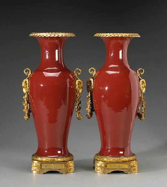 Appraisal: A pair of Chinese copper red glazed porcelain gilt bronze