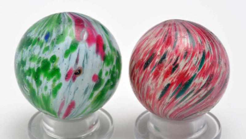 Appraisal: Lot of Onionskin Marbles Description Smaller marble has a white