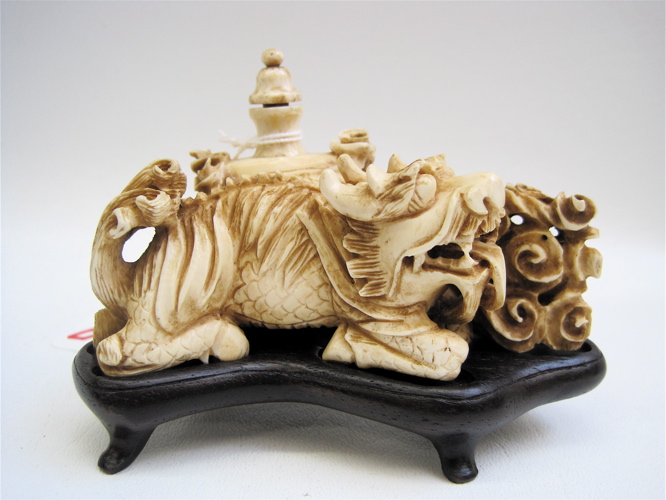 Appraisal: LARGE IVORY CARVED FIGURAL SNUFF BOTTLE attached to a large