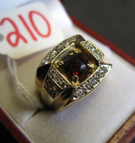 Appraisal: MAN'S GARNET DIAMOND AND FOURTEEN KARAT GOLD PINKIE RING Centered