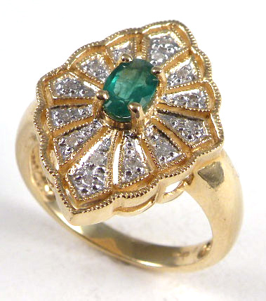 Appraisal: EMERALD DIAMOND AND TEN KARAT GOLD RING centering an oval-cut