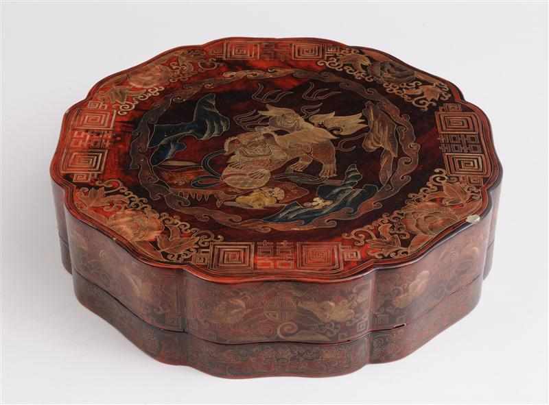 Appraisal: CHINESE RED LACQUER BOX AND COVER The serpentine octagonal cover