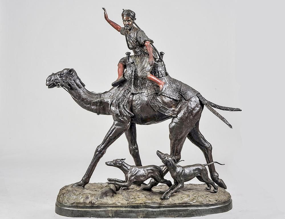 Appraisal: LARGE PATINATED BRONZE GROUP Of a hunter riding a camel