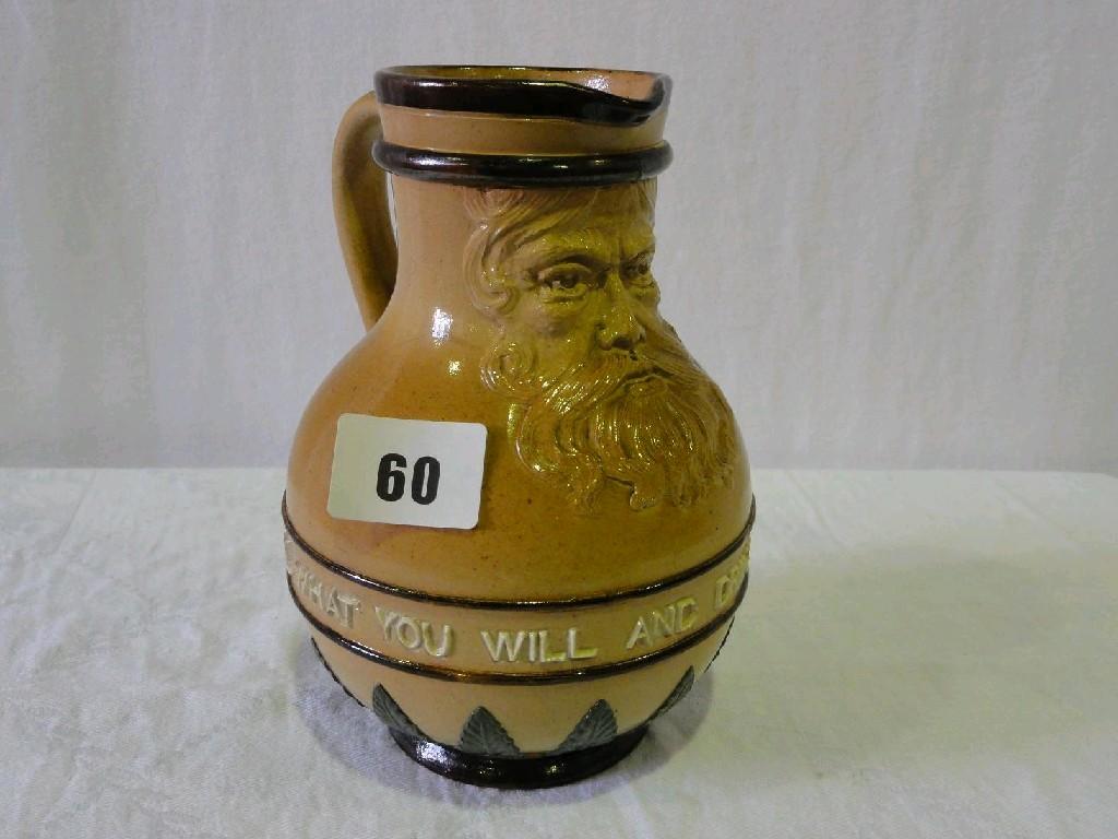 Appraisal: A Doulton Lambeth stoneware jug with relief moulded bearded mask