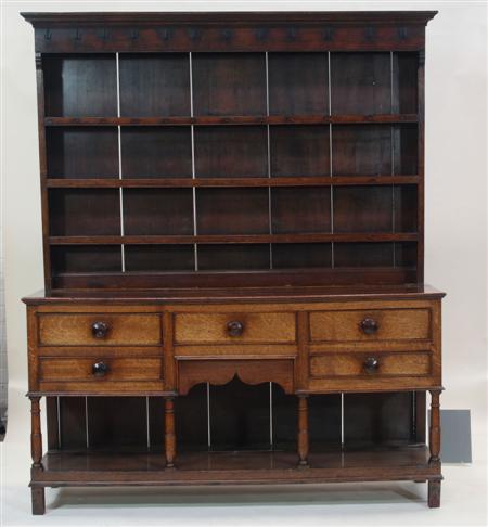 Appraisal: A George III oak dresser the projected moulded cornice above