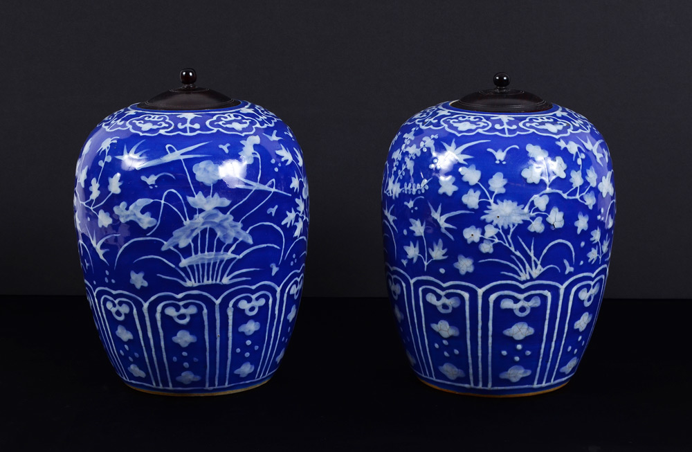 Appraisal: PAIR COVERED BLUE WHITE GINGER JARS Blue ground with raised