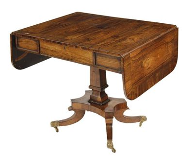 Appraisal: A Regency rosewood sofa table the crossbanded drop-leaf top above