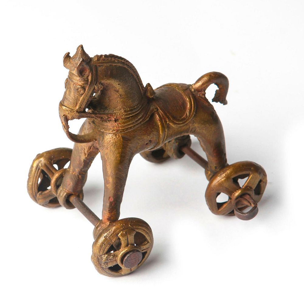 Appraisal: ANTIQUE INDIAN BRONZE TOY HORSE Features horse supported on wheels