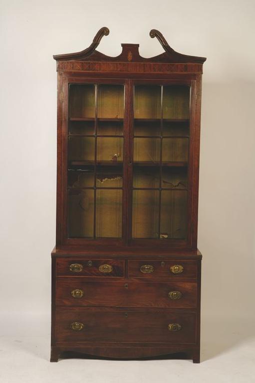 Appraisal: A REGENCY MAHOGANY CABINET the upper section with twin glazed