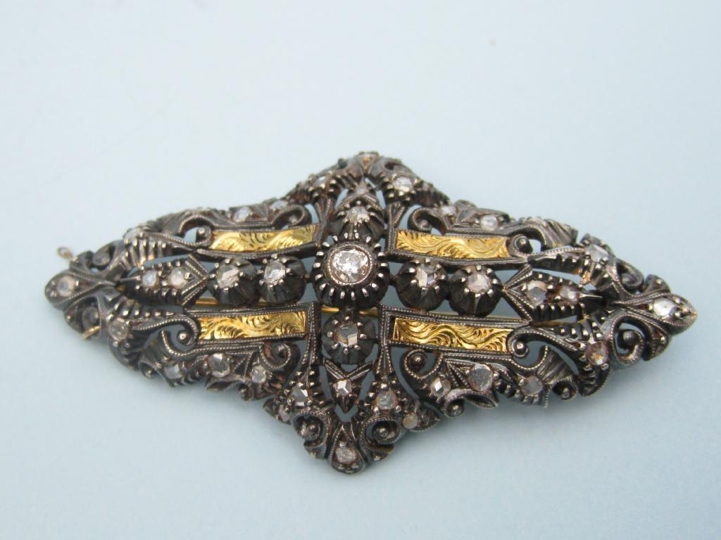 Appraisal: A Portuguese Diamond Brooch the circular-cut and rose-cut stones claw-set