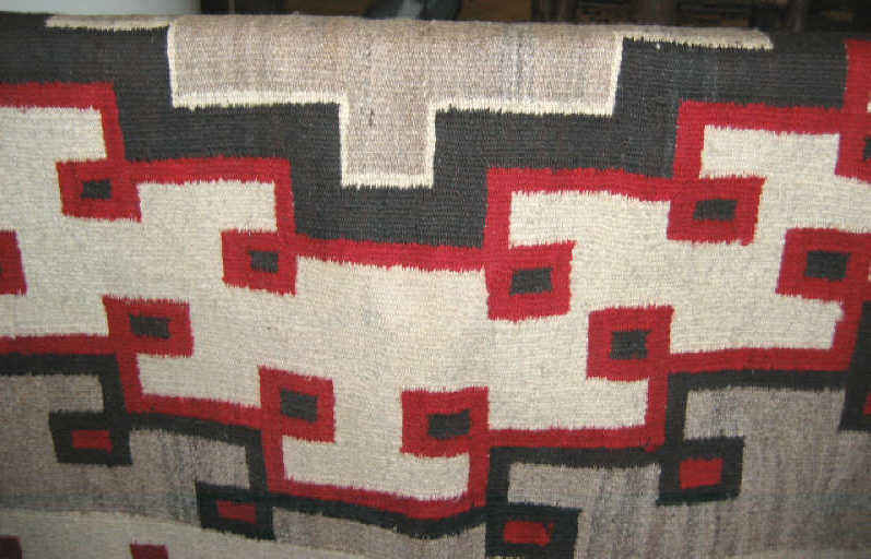 Appraisal: NAVAJO BLANKET Two grey hills geometric design with corner ties