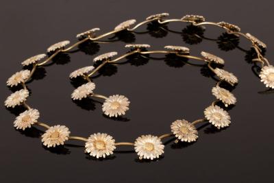 Appraisal: A silver necklace modelled as a daisy chain NP London