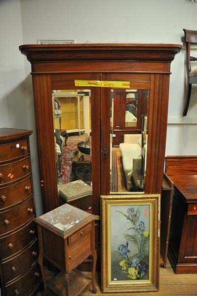 Appraisal: A LATE VICTORIAN WARDROBE WITH TWO MIRROR PANELLED DOORS