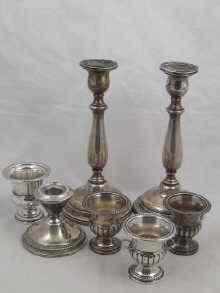 Appraisal: American silver A pair of candlesticks ht cm a dwarf