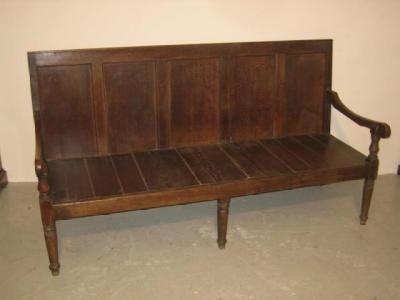 Appraisal: A GEORGE III OAK SETTLE the back with four panels