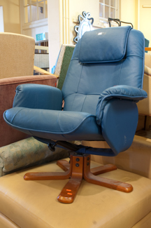 Appraisal: BLUE SWIVEL CHAIR WITH MATCHING OTTOMAN