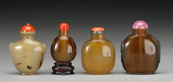 Appraisal: Four agate snuff bottles The first a flattened baluster bottle