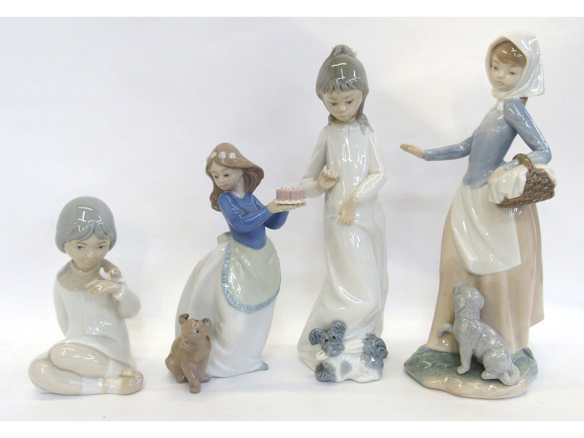 Appraisal: Two Nao figures of girls and dog another def and