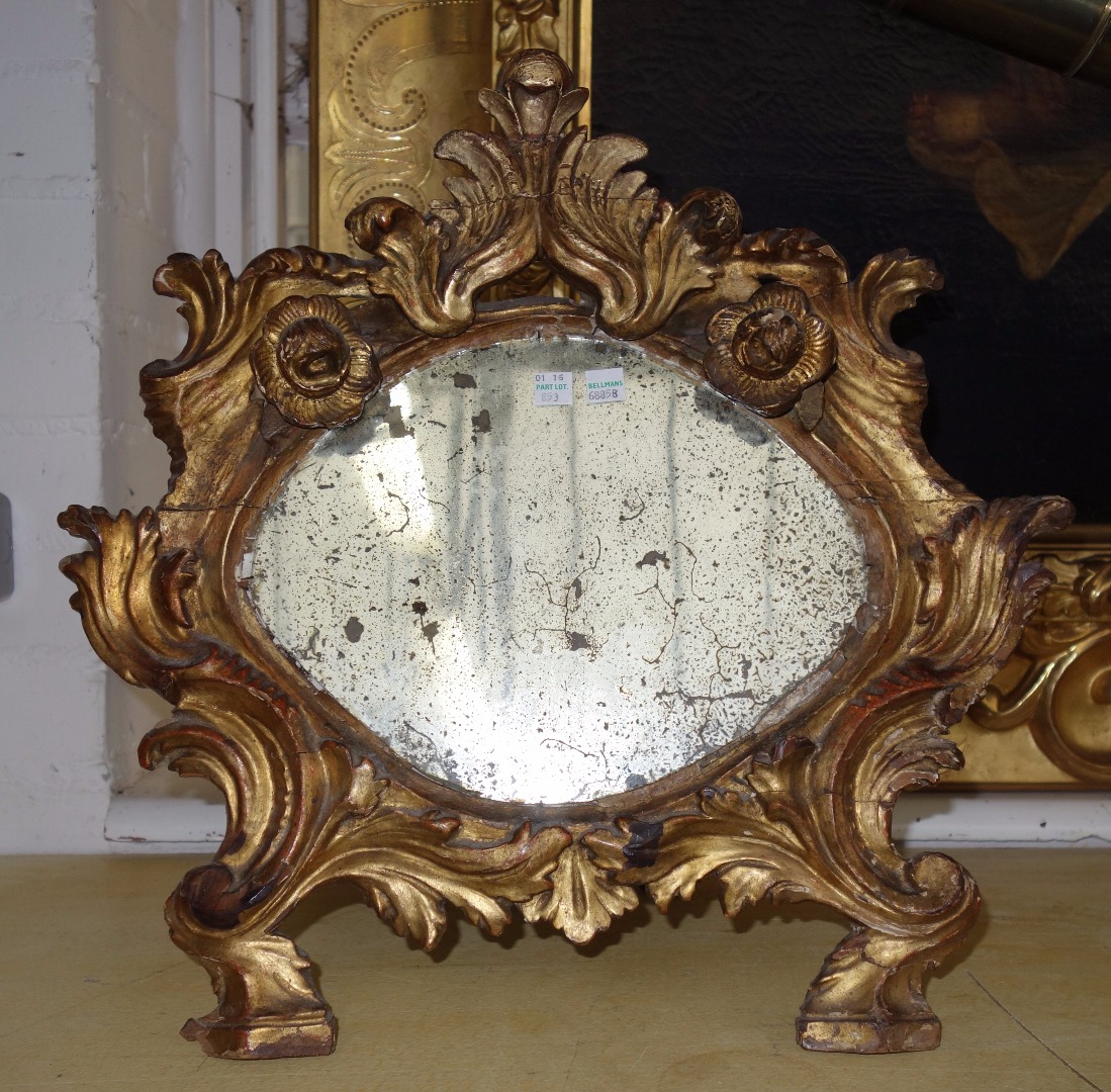 Appraisal: An early th century mirror the bevelled shaped plate with