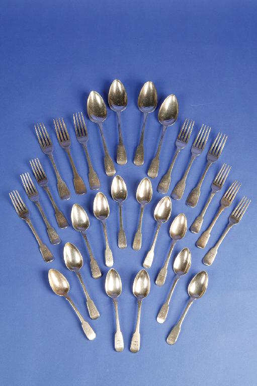 Appraisal: A COMPOSITE CANTEEN OF GEORGE III FIDDLE PATTERN CUTLERY crested