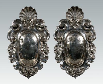 Appraisal: Pair silver plated plaques oval shields shell finials scroll and