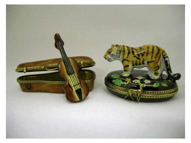 Appraisal: Lot of two Limoges hinged porcelain boxes including figural tiger