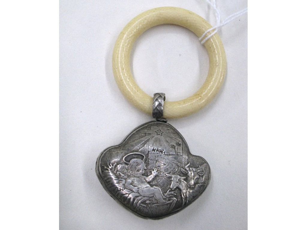 Appraisal: White metal and ivory baby rattle embossed with nativity scenes