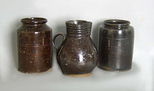 Appraisal: Redware pitcher h together with crocks th c h and