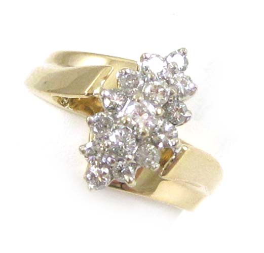 Appraisal: DIAMOND AND FOURTEEN KARAT GOLD CLUSTER RING set with round-cut