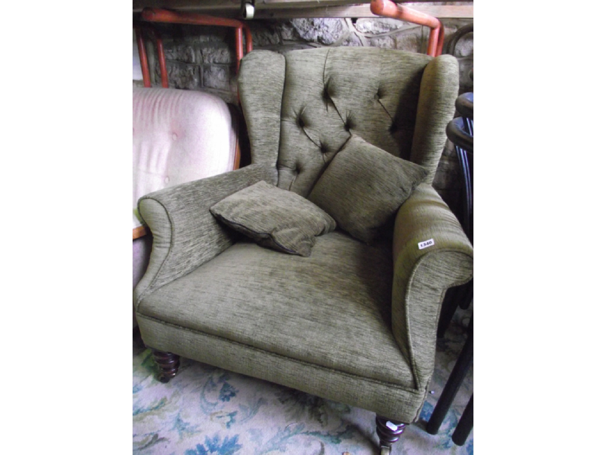 Appraisal: An Edwardian wing armchair recently re-upholstered in a mid green