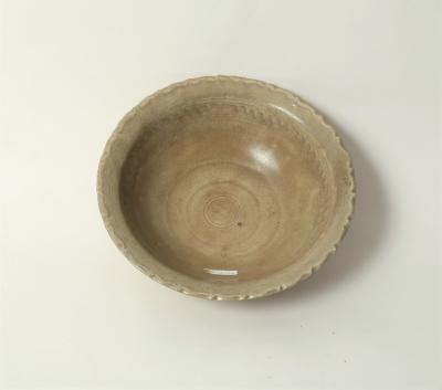 Appraisal: A Chinese celadon bowl Yuan dynasty with moulded wavy rim