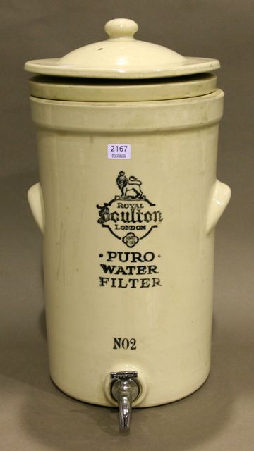 Appraisal: A Royal Doulton stoneware cylindrical water filter and cover in