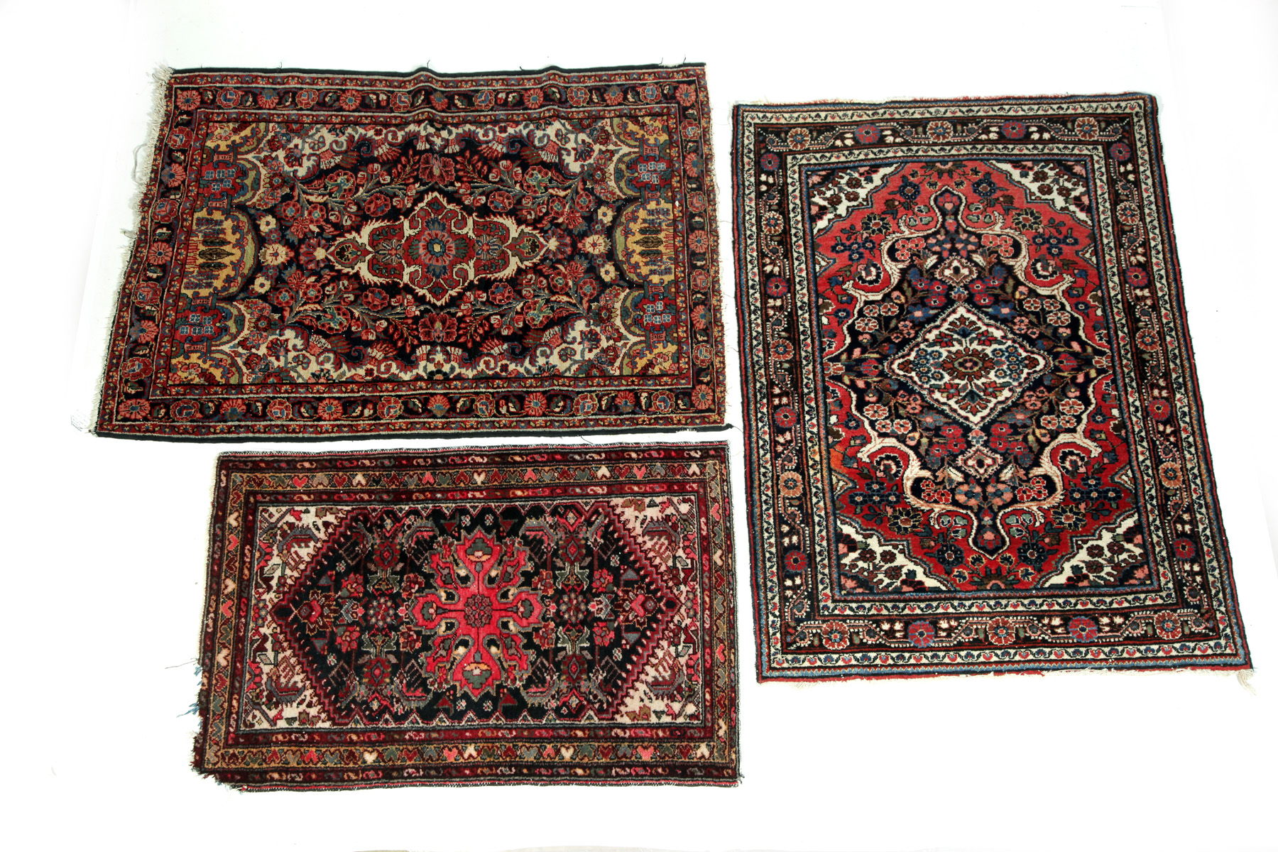 Appraisal: THREE GEOMETRIC ORIENTAL THROW RUGS Asian st quarter- th century