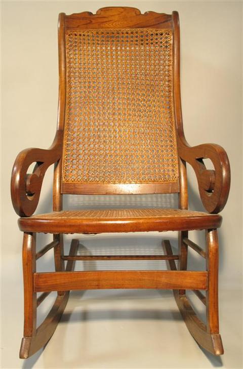 Appraisal: VICTORIAN CANE BACK ROCKING CHAIR The rectangular back with shaped