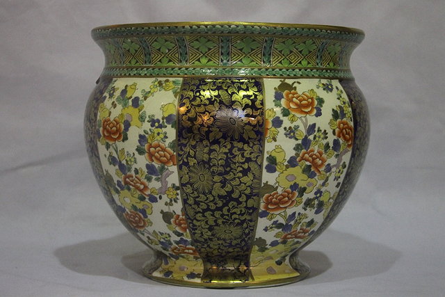 Appraisal: A BRIDGWOOD POTTERY CIRCULAR JARDINIERE with panels of flowers alternating