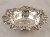 Appraisal: An American silver bowl with embossed floral rim wt g