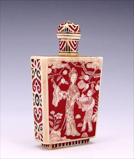 Appraisal: ENAMELED JAPANESE IVORY SNUFF BOTTLE Red black and gold with