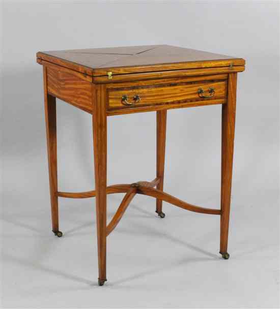 Appraisal: An Edwardian inlaid satinwood envelope card table on square tapered