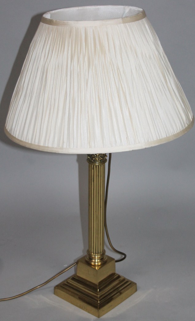 Appraisal: A thC style brass column table lamp the cylindrical fluted