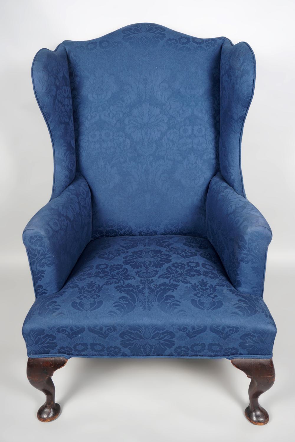 Appraisal: GEORGE III STYLE MAHOGANY WING ARMCHAIR the eared serpentine rectangular