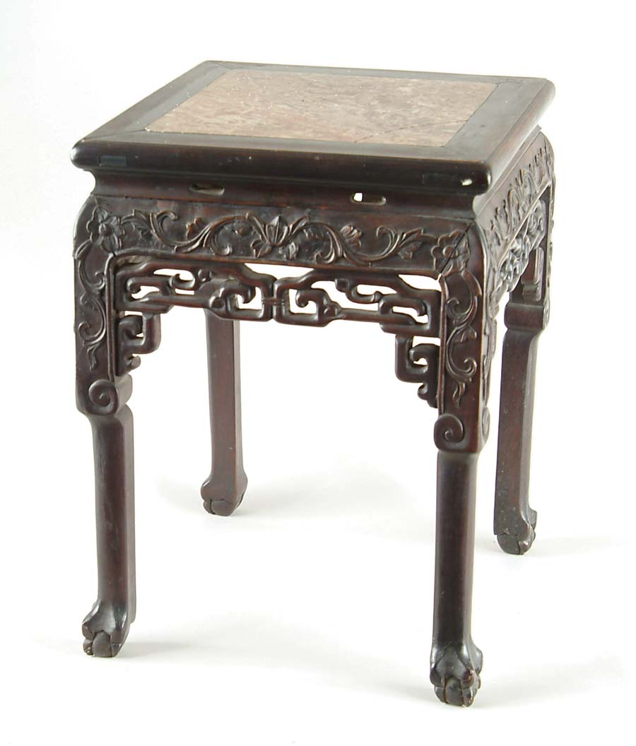 Appraisal: CHINESE ROSEWOOD AND MARBLE STAND Carved skirted stand raised on