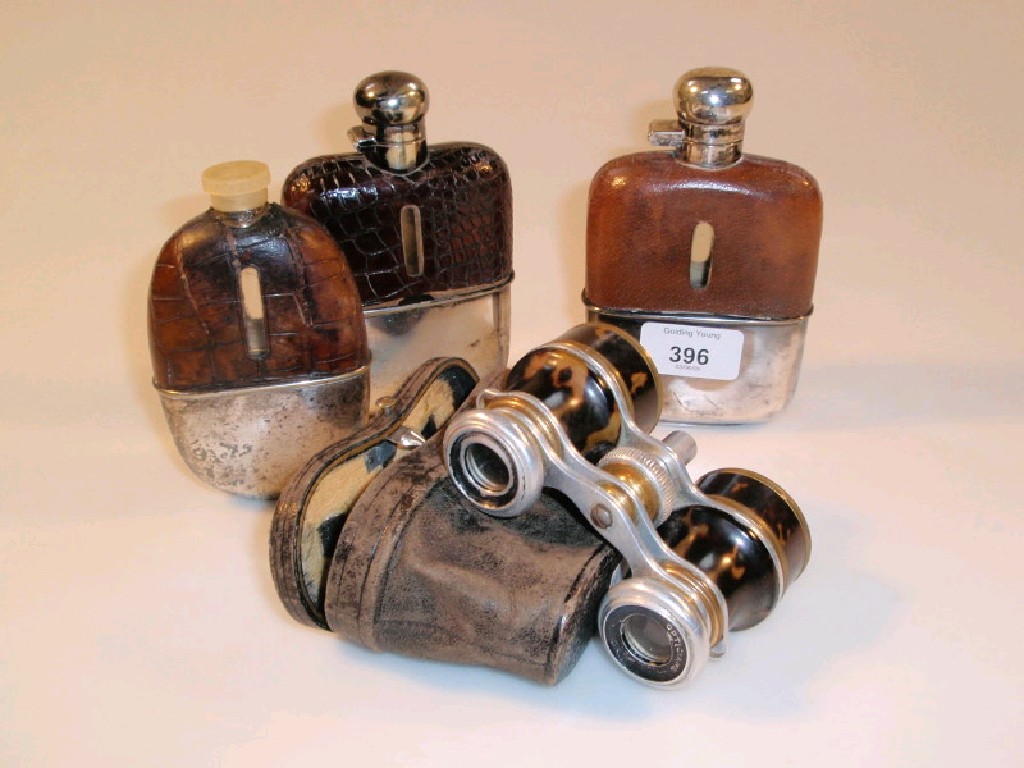 Appraisal: Three silver plated and leather covered hip flasks together with