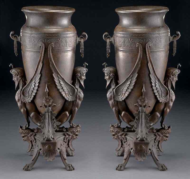 Appraisal: Pr Renaissance Revival bronze urns supported bywinged figures each standing