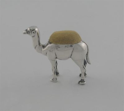 Appraisal: An Edwardian novelty camel pin cushion standing by Adie Lovekin