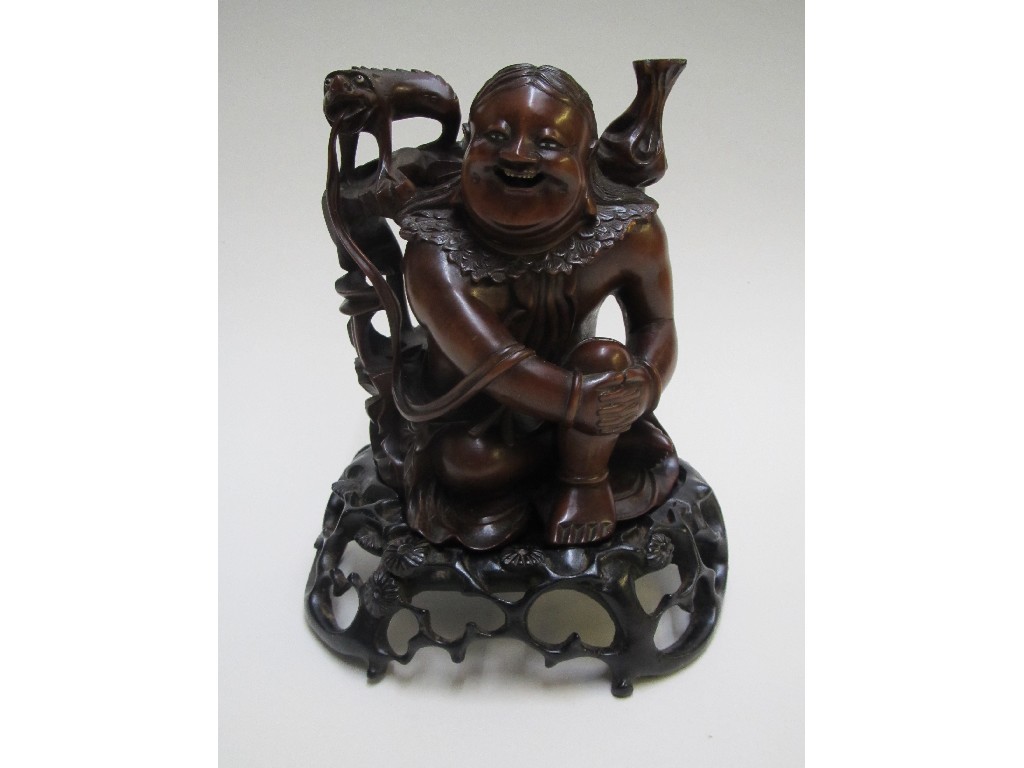 Appraisal: A Chinese hardwood figure of Hotei carved seated with sack