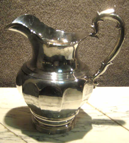 Appraisal: WILLIAM G FORBES NEW YORK NY Silver water pitcher twelve-paneled