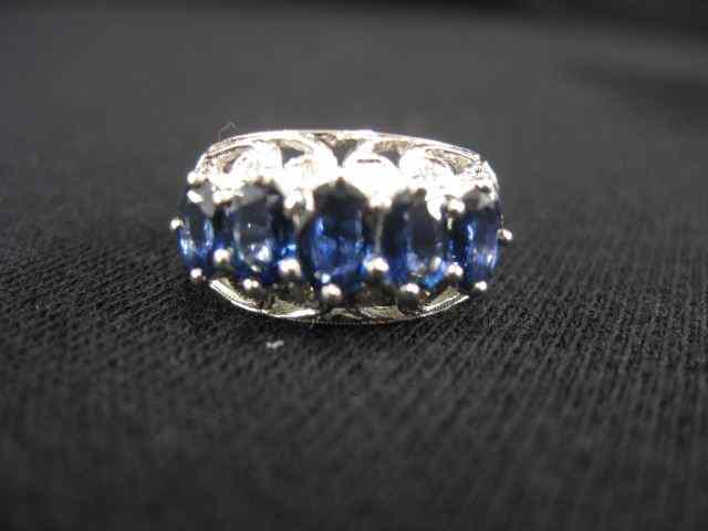 Appraisal: Sapphire Diamond Ring five oval gemsrich vibrant blue totaling carats