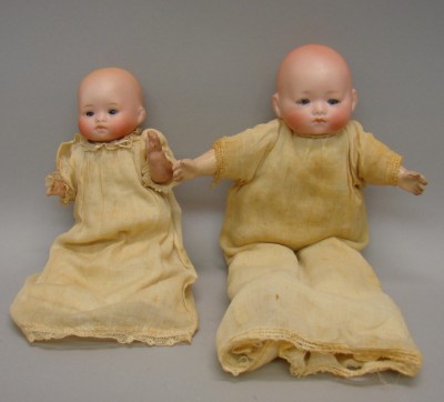 Appraisal: Pair of solid dome dolls Germany Pc papier mache toddler