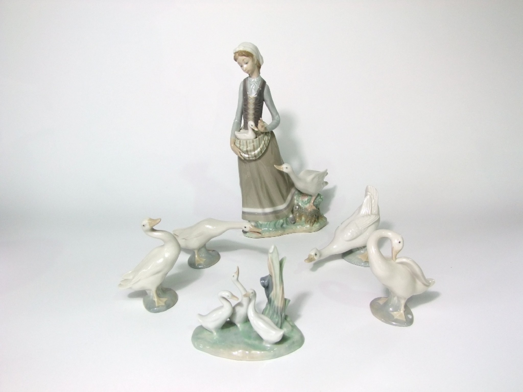 Appraisal: A Lladro figure group of a girl carrying a gosling