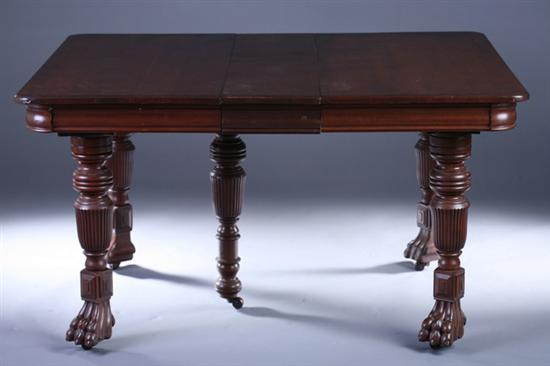 Appraisal: VICTORIAN CARVED WALNUT EXPANDABLE DINING TABLE th century with three